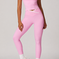 Person wearing a pink athletic outfit on a plain background