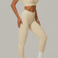 Cream Beige women's activewear, pilates, gym and yoga set with high-waisted leggings and fitted crop top.