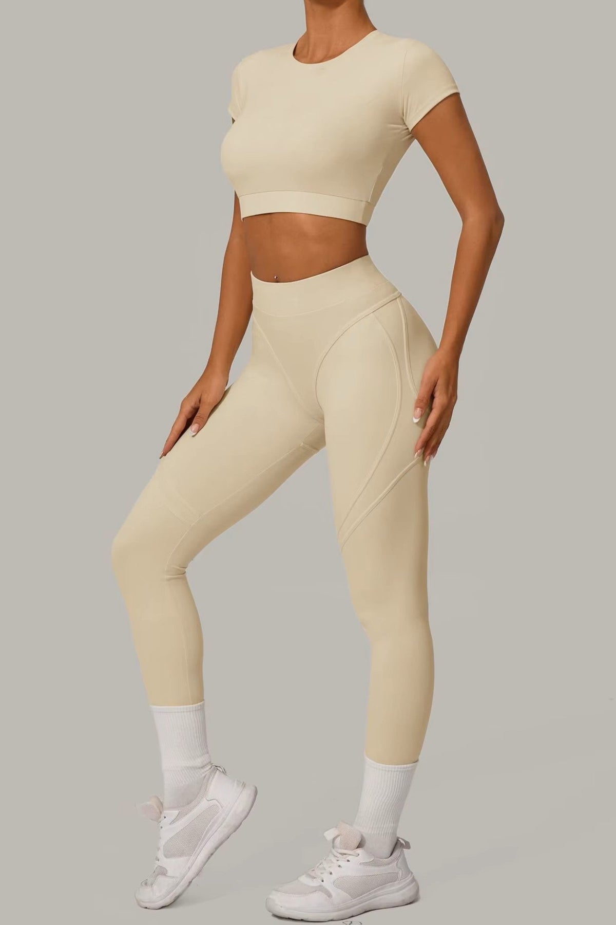 Cream Beige women's activewear, pilates, gym and yoga set with high-waisted leggings and fitted crop top.