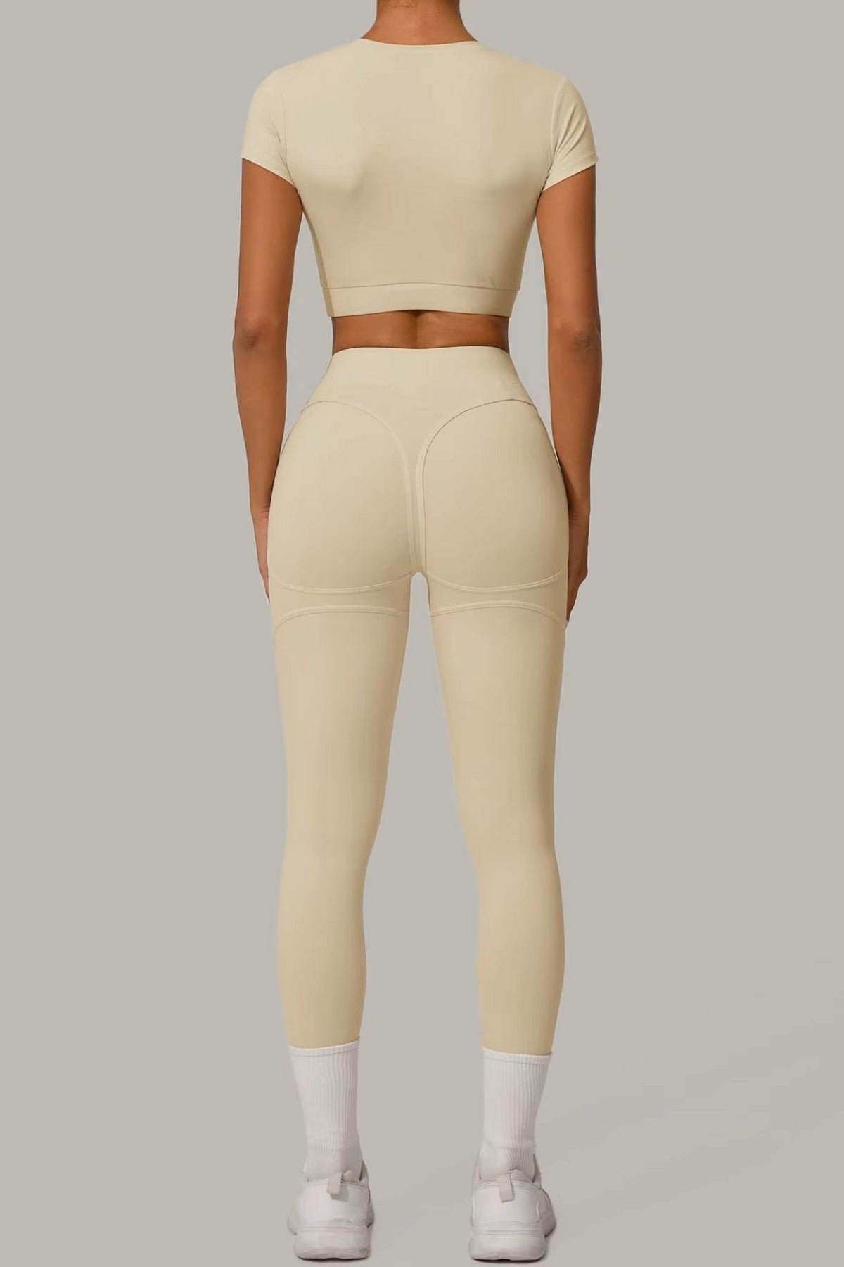 Cream Beige women's activewear, pilates, gym and yoga set with high-waisted leggings and fitted crop top.