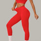 Striking red women's activewear, pilates, gym and yoga set with high-waisted leggings and fitted crop top.