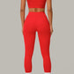 Striking red women's activewear, pilates, gym and yoga set with high-waisted leggings and fitted crop top.